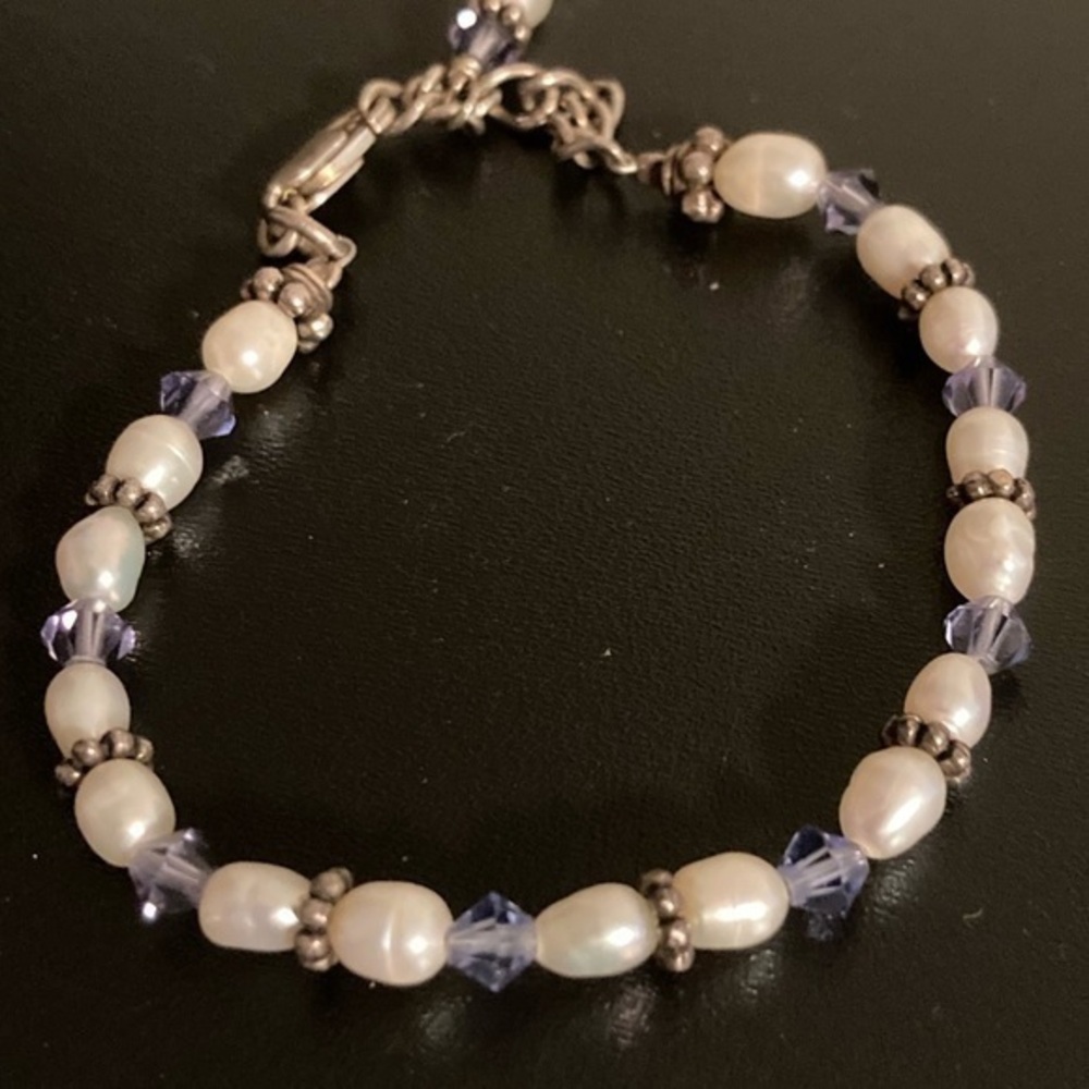 Beautiful purple and pearly beaded bracelet. Very small.